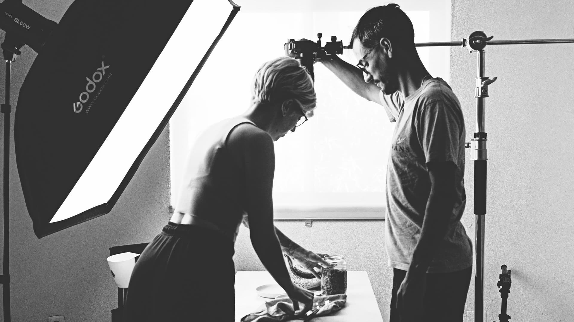 Behind the scenes of a food photography session with Rita and André setting up the shot.