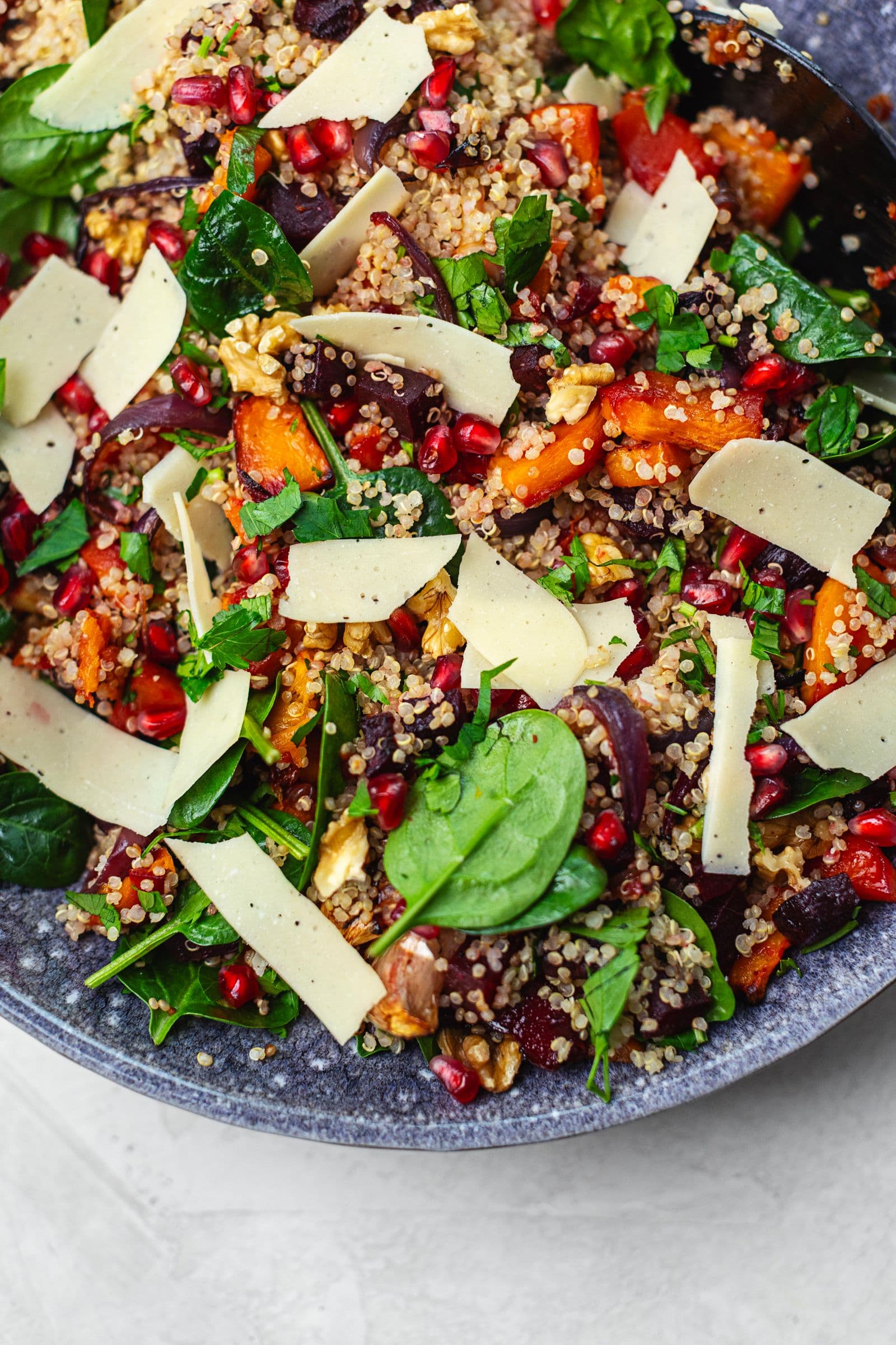 Winter quinoa salad with roasted squash, beetroot, spinach, pomegranate, walnuts and vegan cheese.