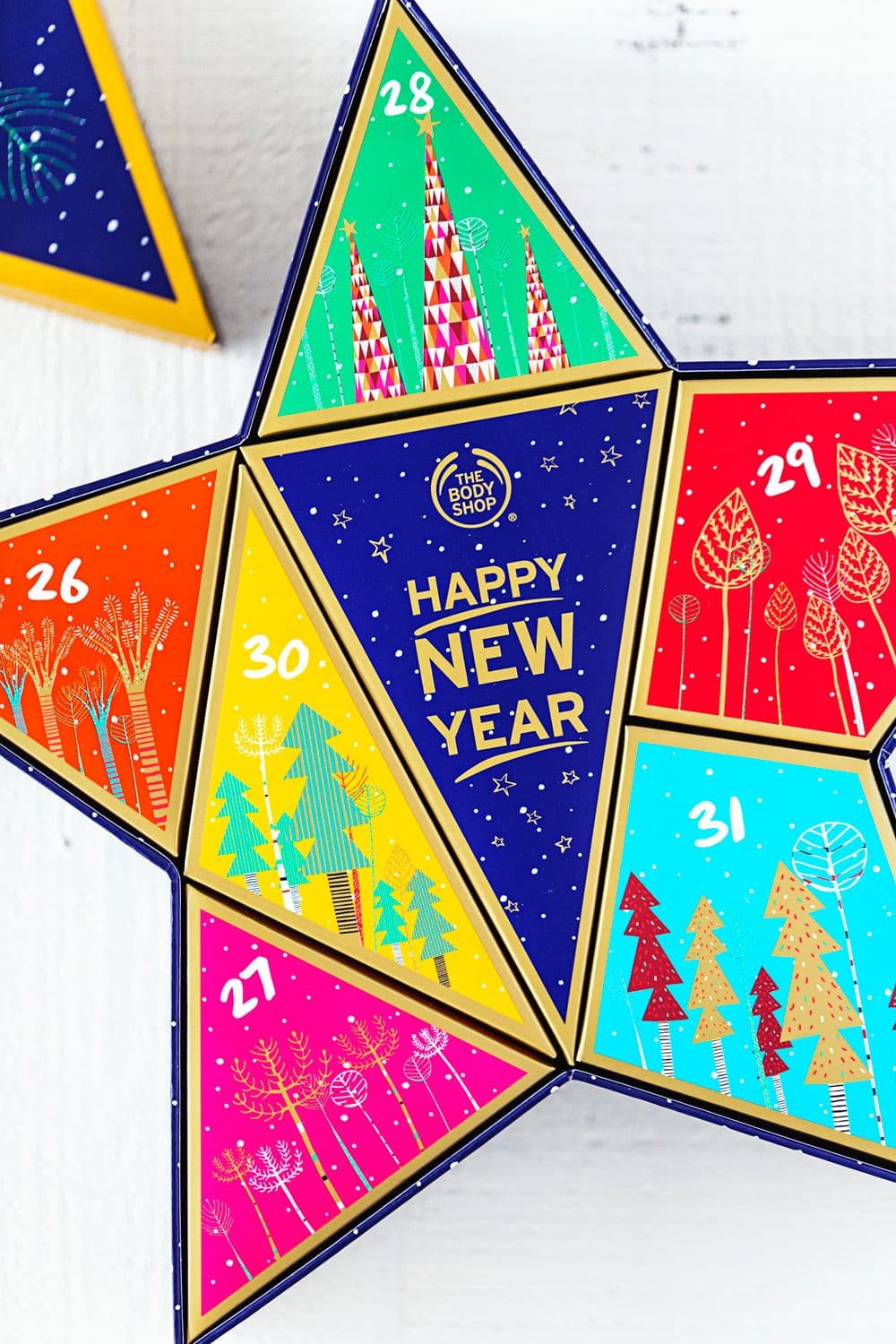 Star-shaped The Body Shop box, “Vegan Countdown to New Year”, featuring vibrant colours and numbered days 26 to 31.